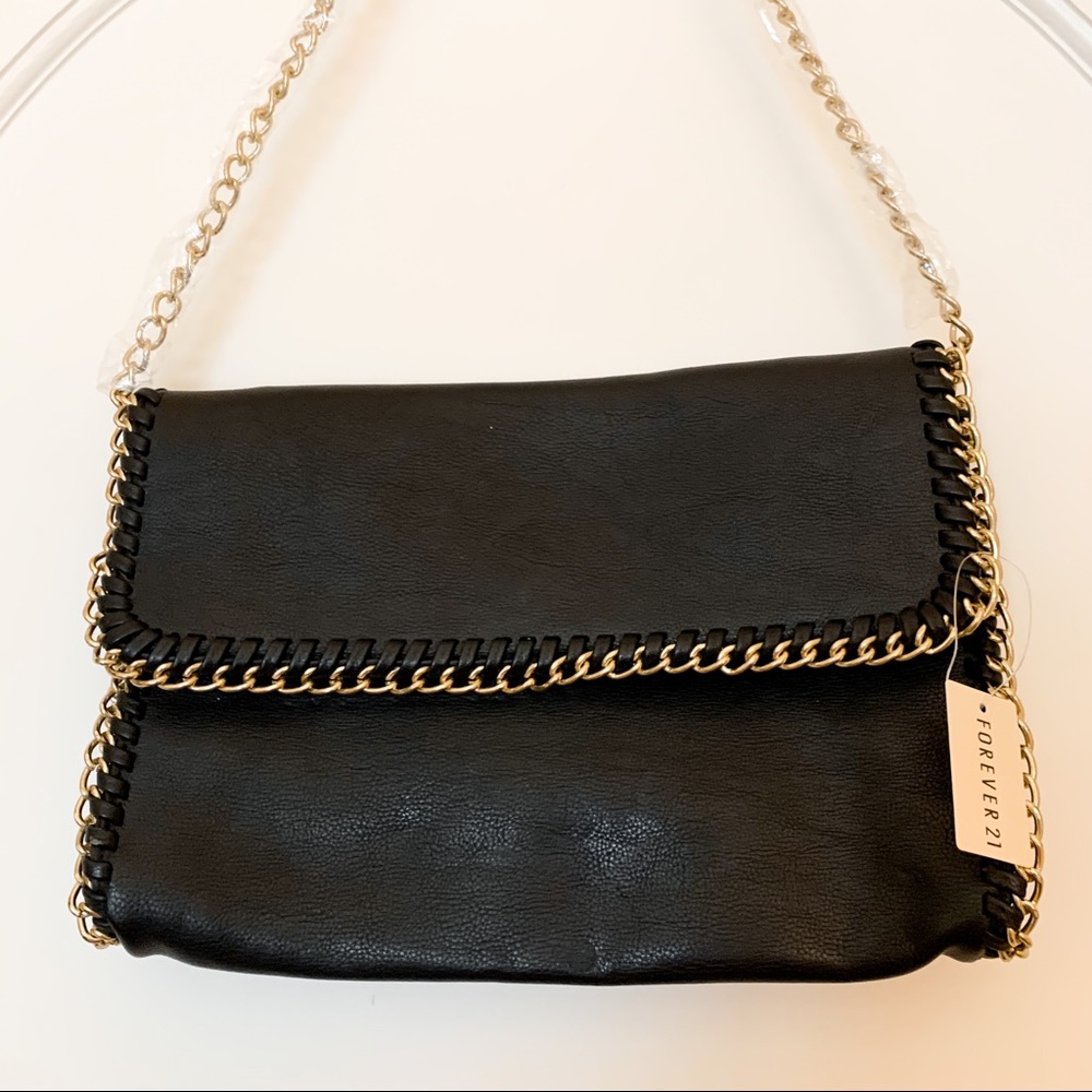 Black purse with gold chain detail